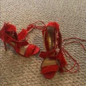 Red strap up fringe heels